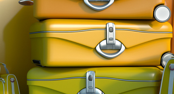 Yellow luggage on blue background