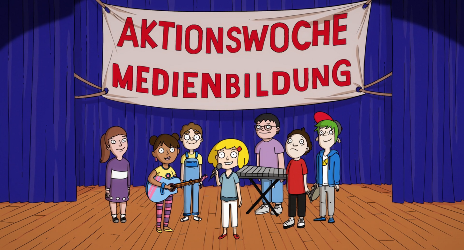 Bild aus dem Jubiläums-Clip zum zehnjährigen Bestehen der Initiative Kindermedienland Baden-Württemberg: Eine Gruppe Jugendlicher steht auf einer Bühne, darüber ein Banner mit der Aufschrift „Aktionswoche Medienbildung“.